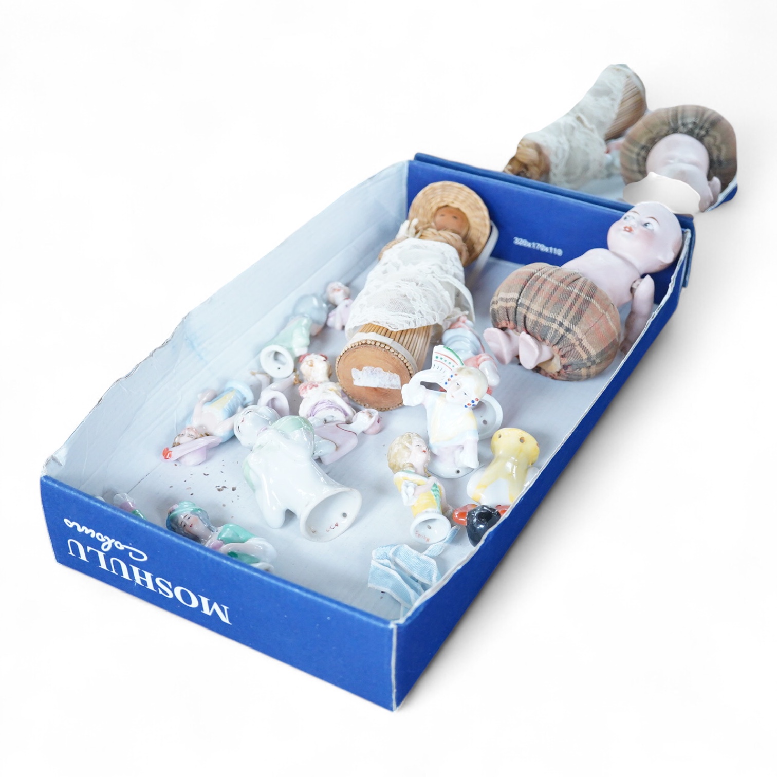 A collection of vintage porcelain half dolls and a bisque porcelain example with jointed limbs